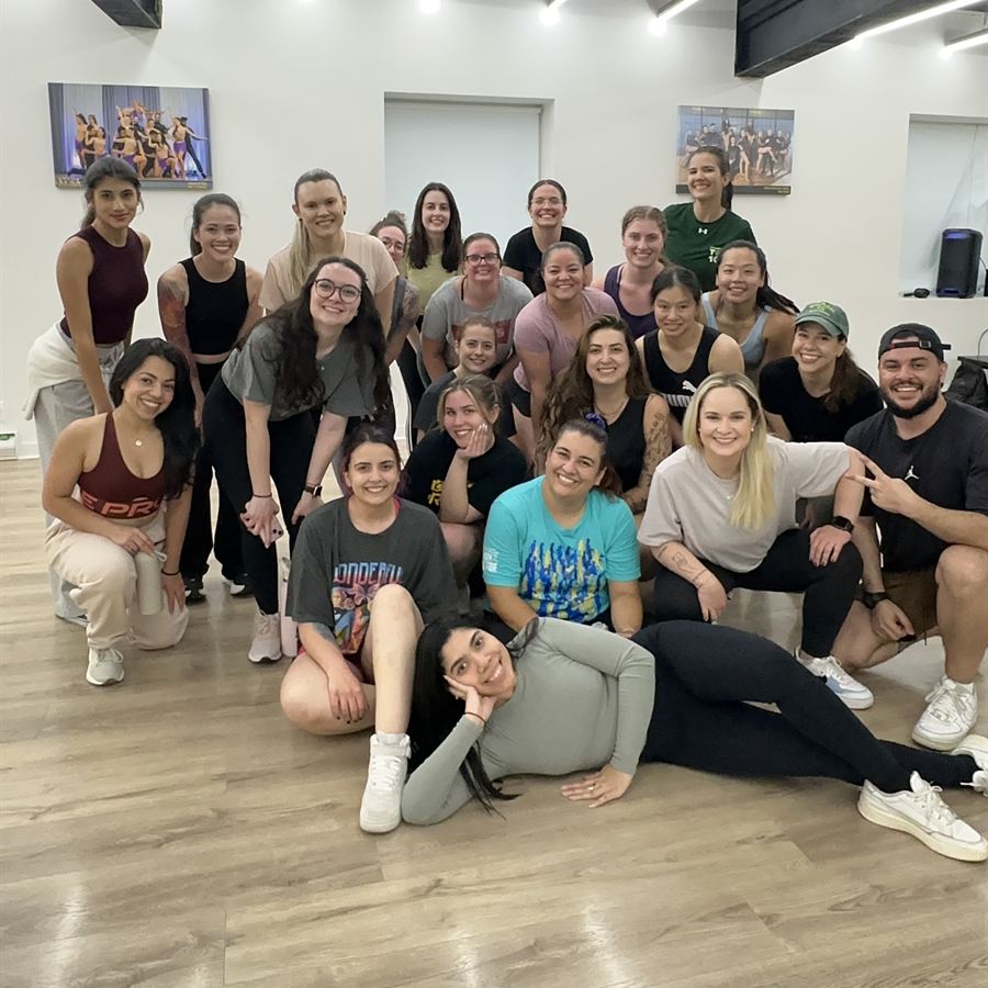 Big group of Brasileirada students smiling after class at the Midtown studio